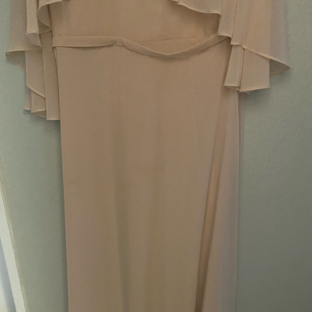 a line dress appliqué flower detail on shoulders , flutter sleeve, cape